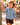 Child in the reversible muslin shirt strolling through a market