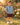 Smiling boy wearing the reversible muslin shirt in a golden garden